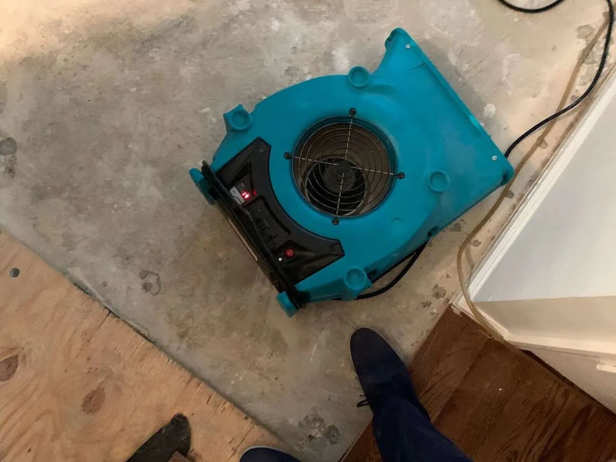 Air mover drying subfloor during Commercial Water Damage Restoration in Damascus